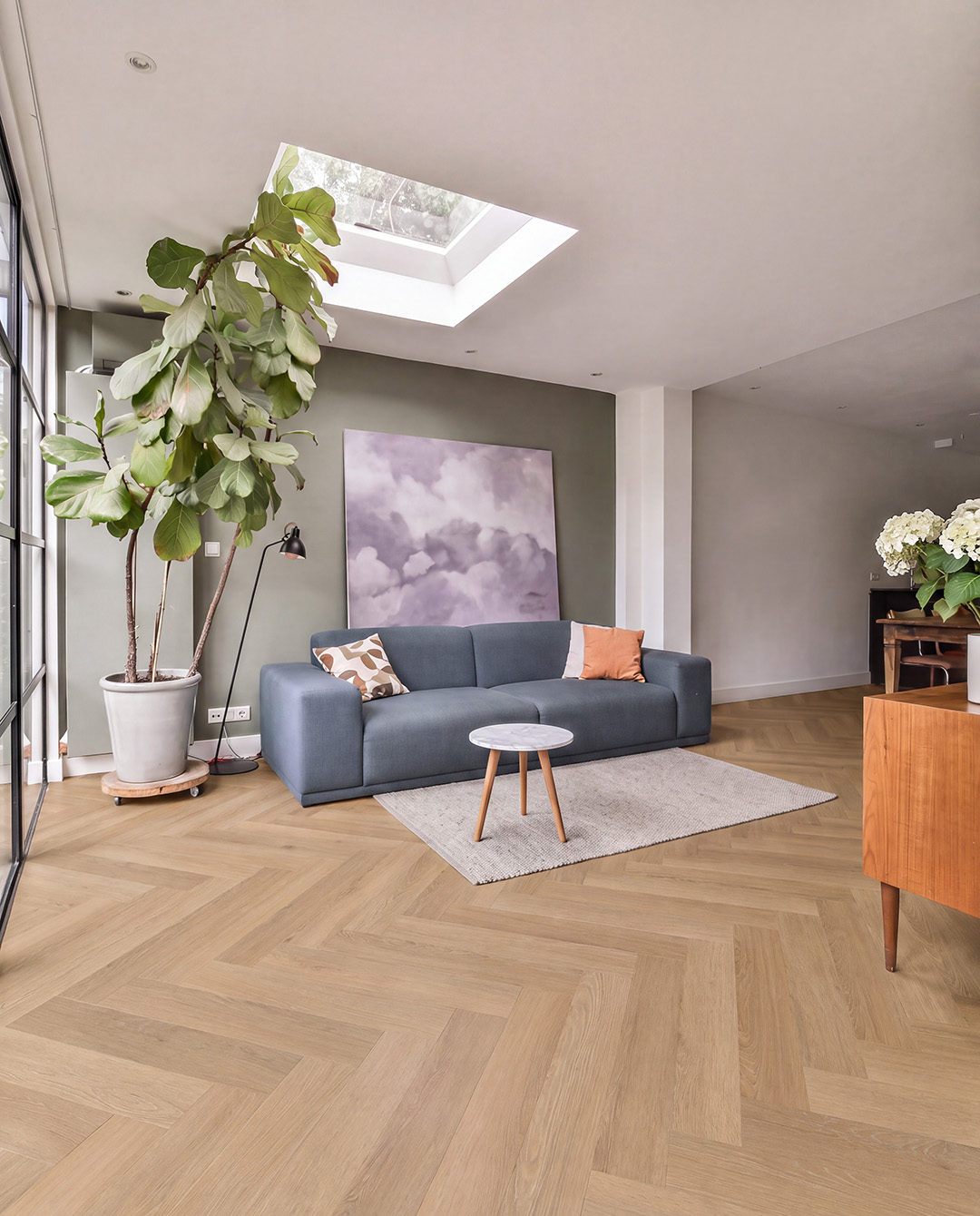 living room, sofa, blue sofa, potted plant, skylight